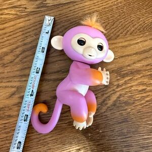 WowWee Fingerlings Interactive Baby Monkey - Purple with Orange Hair